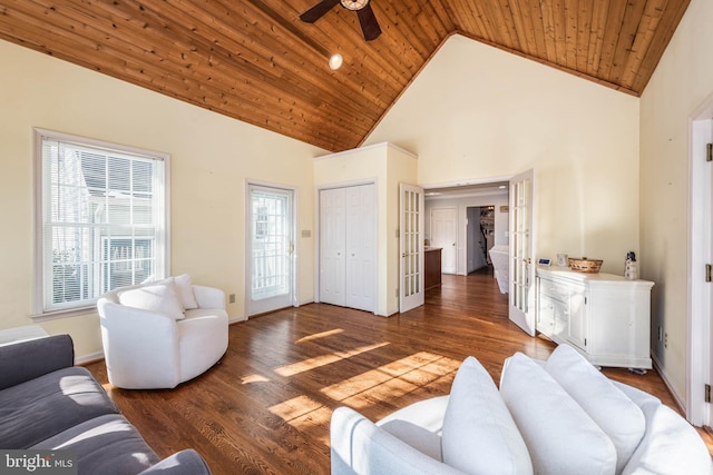 living room with high vaulted ceiling, wood finished floors, wood ceiling, and baseboards