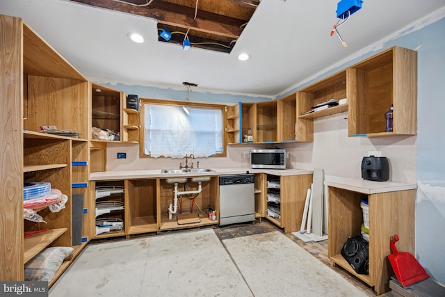 kitchen featuring a sink, light countertops, appliances with stainless steel finishes, open shelves, and brown cabinetry