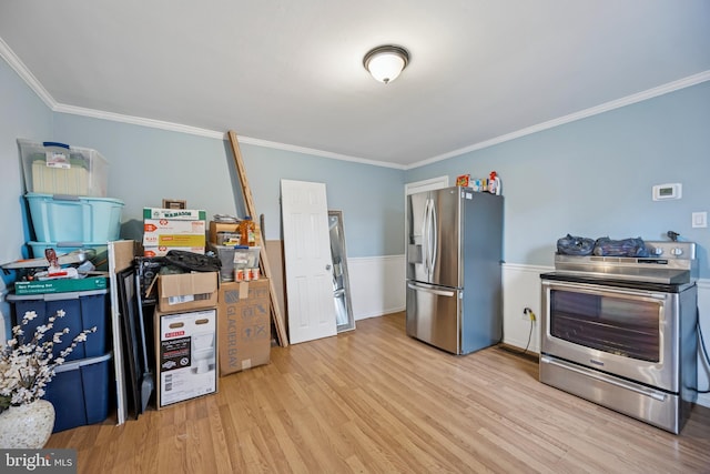 kitchen featuring ornamental molding, stainless steel appliances, and light wood finished floors