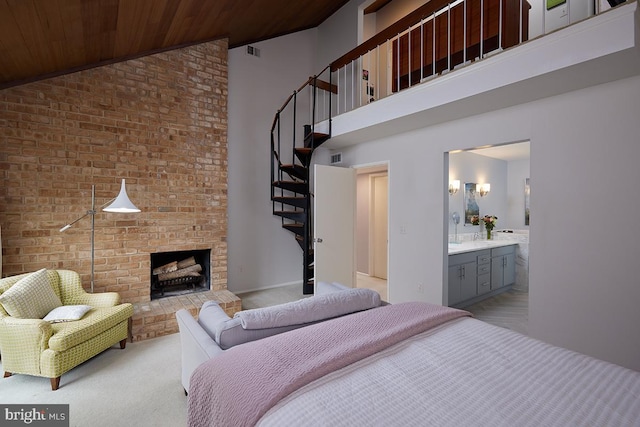 bedroom featuring high vaulted ceiling, a brick fireplace, wooden ceiling, and ensuite bath