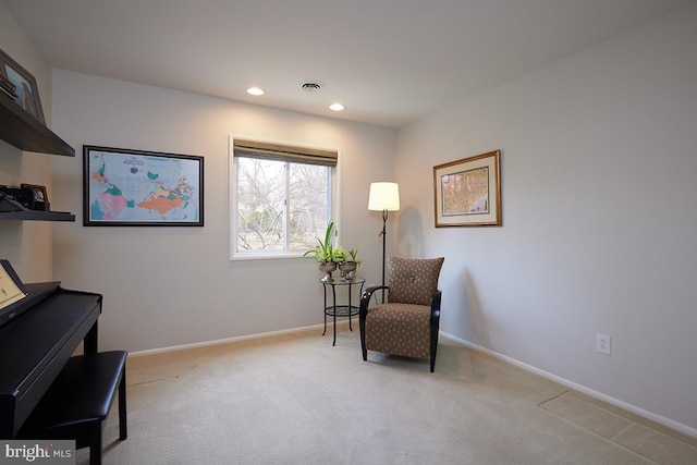 sitting room with light carpet, baseboards, and recessed lighting