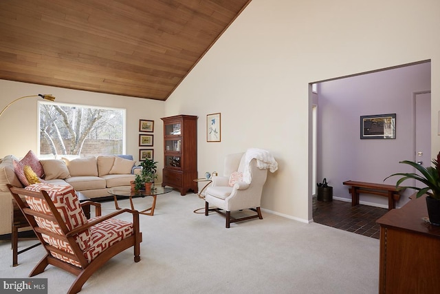 living room with wood ceiling, high vaulted ceiling, baseboards, and light colored carpet