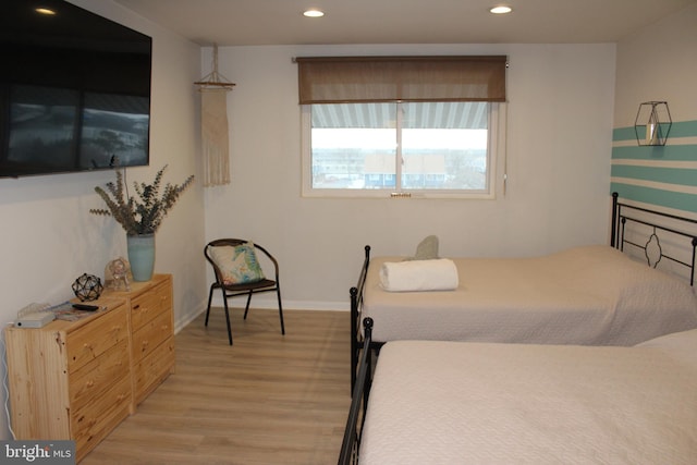 bedroom featuring recessed lighting, baseboards, and light wood-style floors