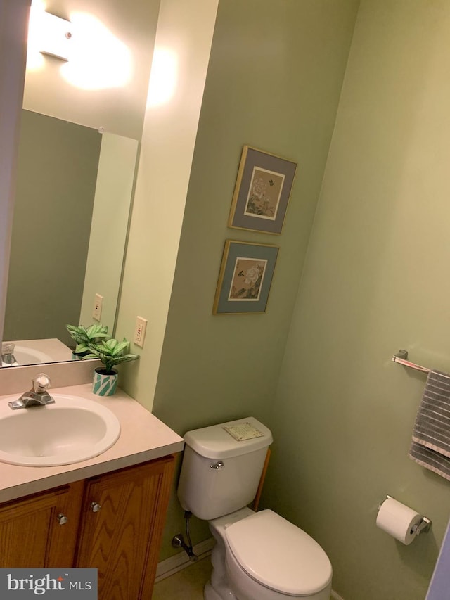 bathroom with toilet and vanity