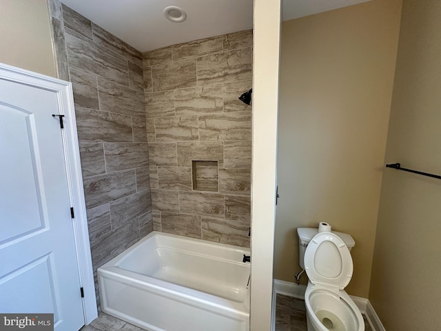 full bath with shower / bath combination, baseboards, and toilet