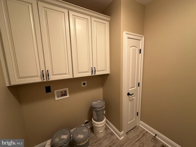 washroom featuring washer hookup, cabinet space, baseboards, and electric dryer hookup