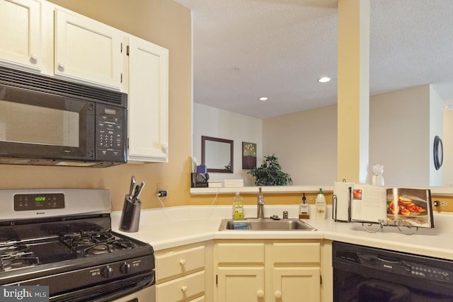 kitchen with recessed lighting, light countertops, a sink, a textured ceiling, and black appliances