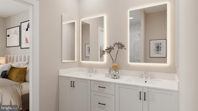 ensuite bathroom featuring double vanity, ensuite bath, and a sink