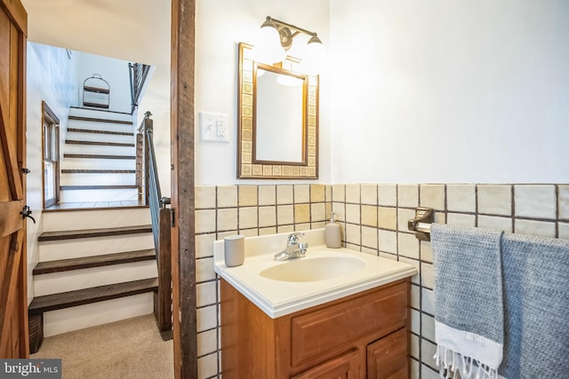 bathroom with tile walls and vanity