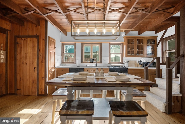 kitchen with light wood finished floors, wood ceiling, and light countertops