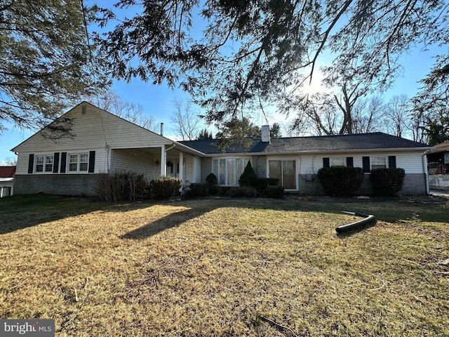 single story home with a front lawn and a chimney