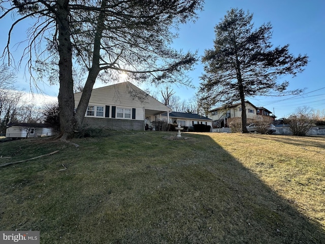 view of home's exterior featuring a yard