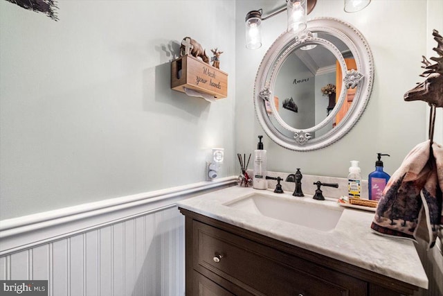 bathroom with wainscoting and vanity