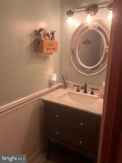 bathroom with wainscoting and vanity