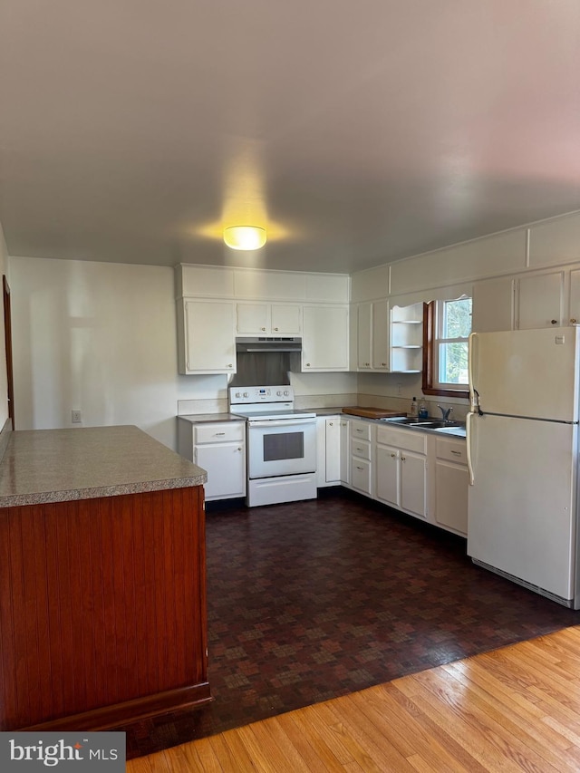 kitchen with white appliances, under cabinet range hood, white cabinetry, and dark wood-type flooring