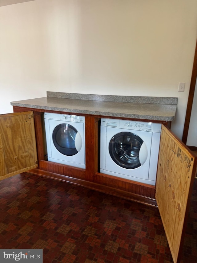 laundry area featuring washing machine and dryer