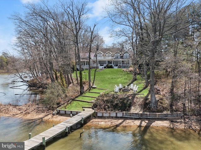 dock area featuring a yard and a water view