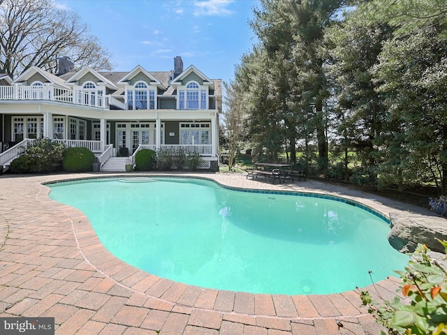 pool with a patio area