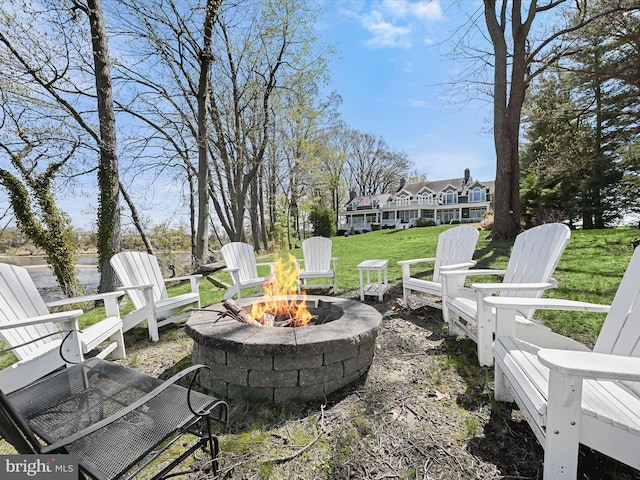 view of yard with an outdoor fire pit