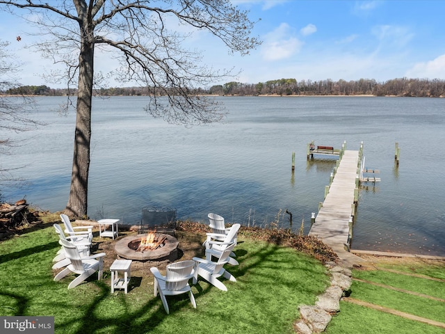 view of dock featuring a water view and an outdoor fire pit