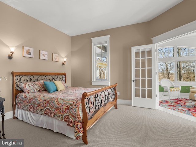bedroom with carpet flooring and baseboards