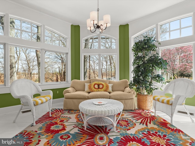 sunroom with a chandelier and visible vents