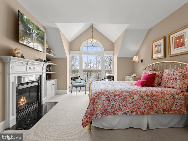 bedroom with a fireplace with flush hearth, carpet floors, a chandelier, lofted ceiling, and baseboards