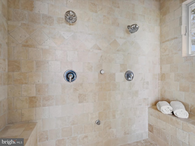 full bath featuring a tile shower