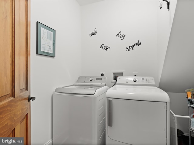 clothes washing area featuring laundry area and separate washer and dryer