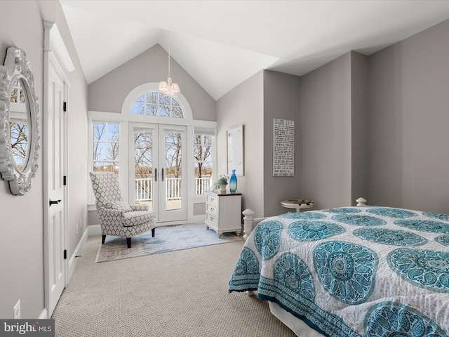carpeted bedroom featuring access to outside, baseboards, an inviting chandelier, french doors, and lofted ceiling