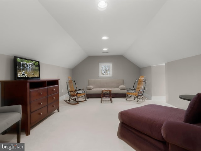 living area featuring recessed lighting, light colored carpet, baseboards, and lofted ceiling