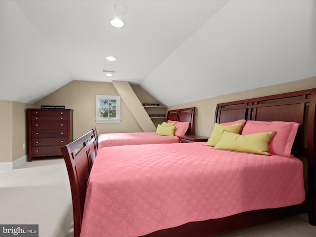 carpeted bedroom featuring visible vents, baseboards, recessed lighting, and vaulted ceiling