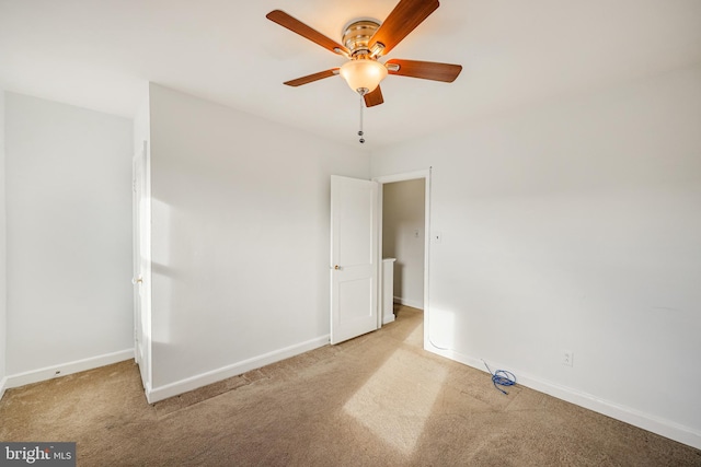 unfurnished bedroom featuring carpet flooring, baseboards, and ceiling fan