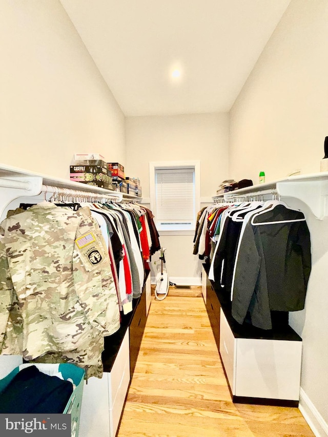 spacious closet with wood finished floors