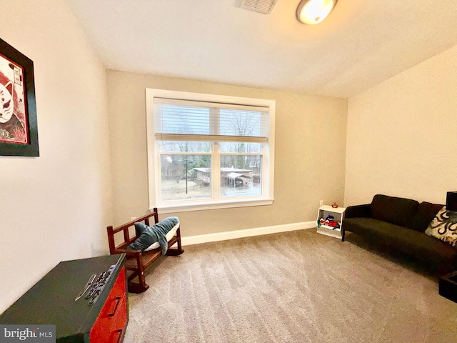 sitting room with visible vents, baseboards, and carpet flooring