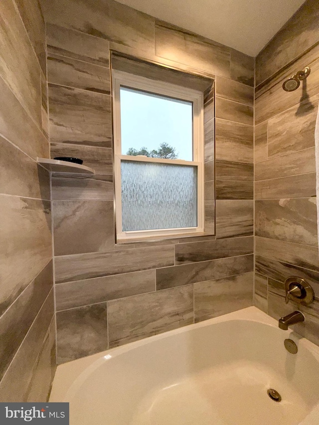 bathroom featuring  shower combination