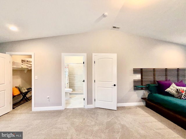 bedroom featuring visible vents, baseboards, carpet, and vaulted ceiling