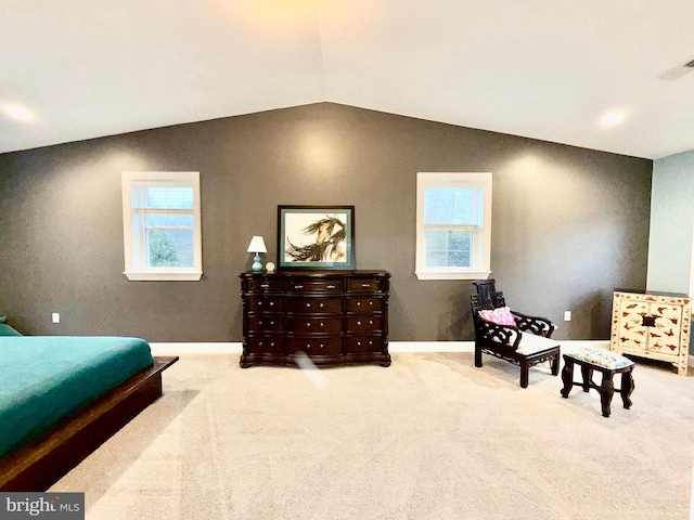 bedroom with carpet floors, baseboards, visible vents, and vaulted ceiling