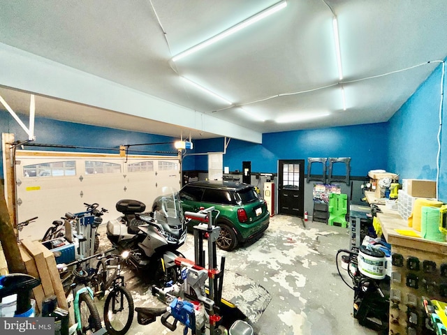 garage featuring a garage door opener