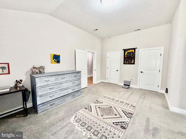 bedroom featuring visible vents, baseboards, carpet, and vaulted ceiling