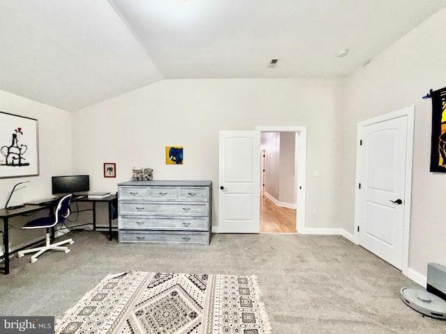 office area with visible vents, baseboards, carpet, and vaulted ceiling