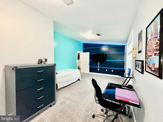 office space with visible vents, carpet floors, and lofted ceiling