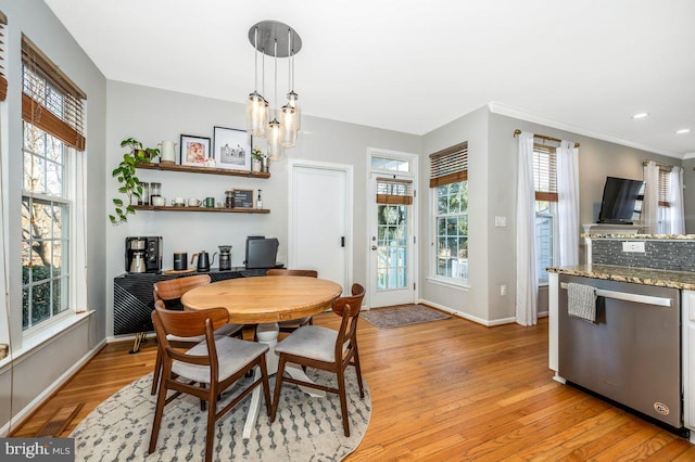 dining space with light wood-style floors, recessed lighting, a chandelier, and baseboards