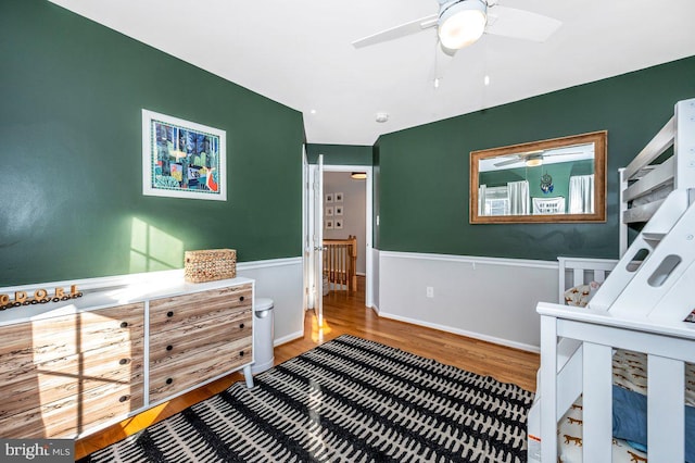 bedroom with baseboards and wood finished floors