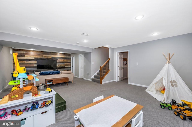 game room with carpet floors, an accent wall, baseboards, and recessed lighting