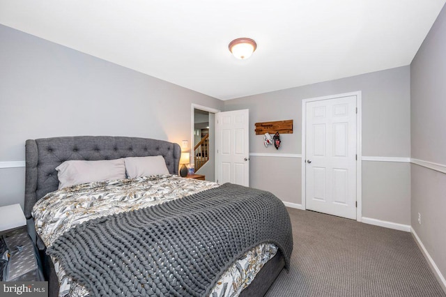 carpeted bedroom featuring baseboards