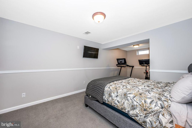 bedroom featuring carpet floors, visible vents, and baseboards