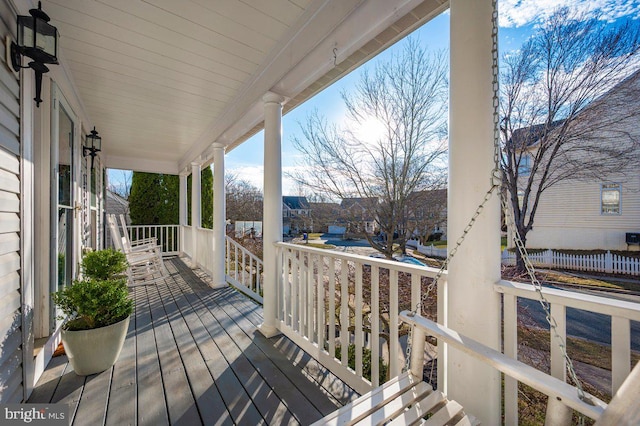 wooden deck featuring covered porch