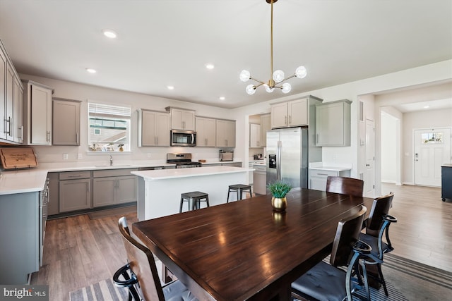 348 Tyson Dr, Berryville, VA 22611 - dining room with plenty of natural light, wood finished floors, a chandelier, and recessed lighting