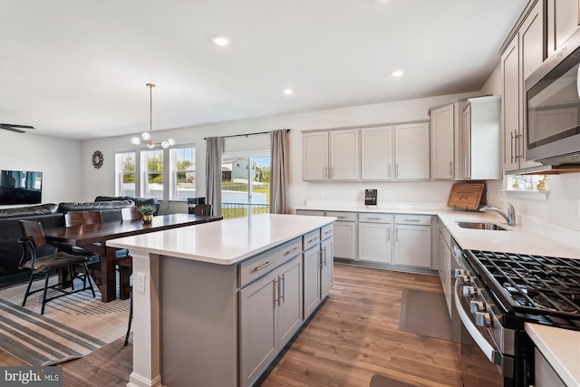 348 Tyson Dr, Berryville, VA 22611 - kitchen featuring gray cabinetry, stainless steel appliances, light wood finished floors, a chandelier, and recessed lighting